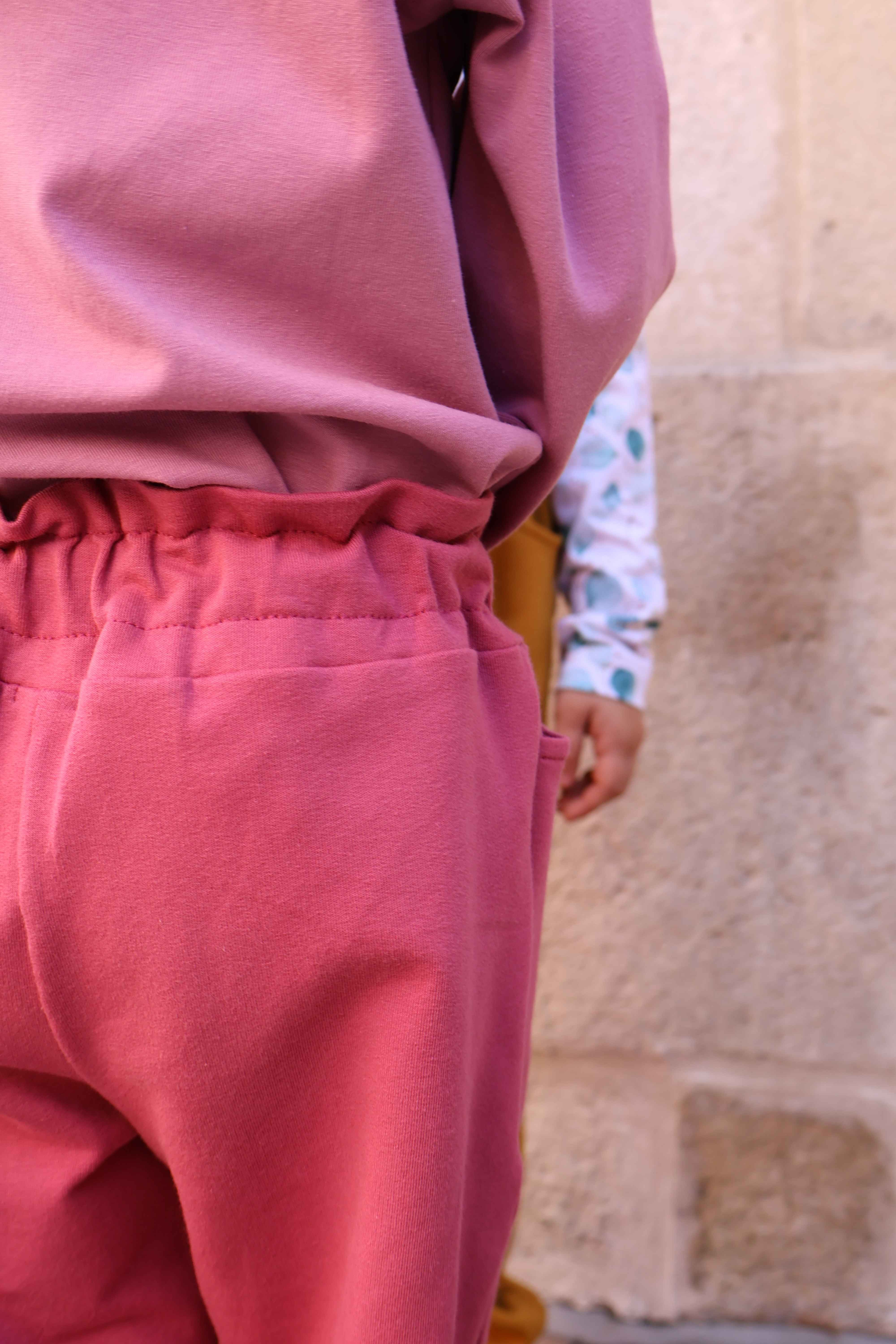 Spodnie z falbanką - różowy